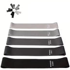 Set of resistance bands in black, gray, and white on a white background